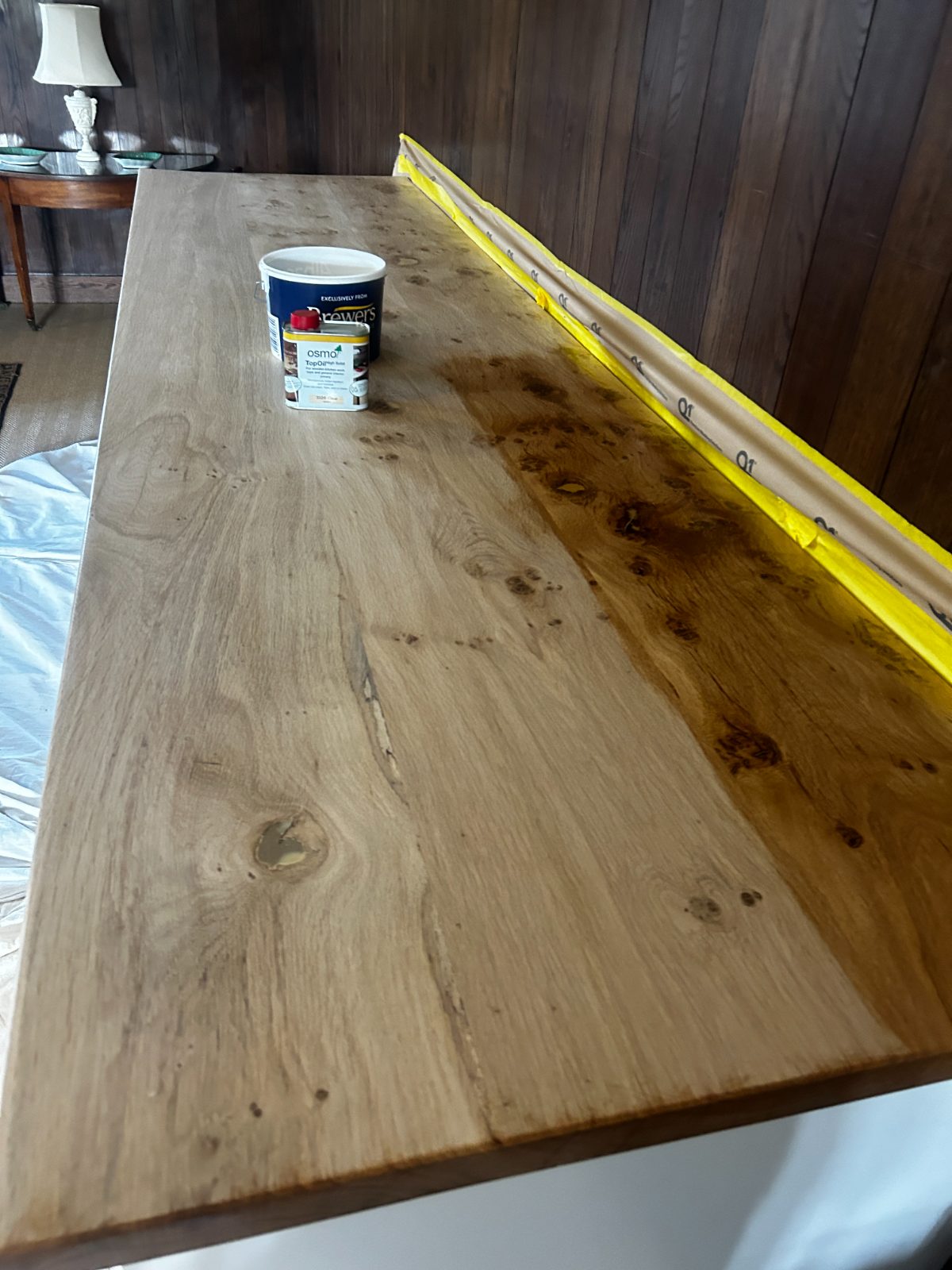 Solid oak worktop being hand-oiled with Osmo finish