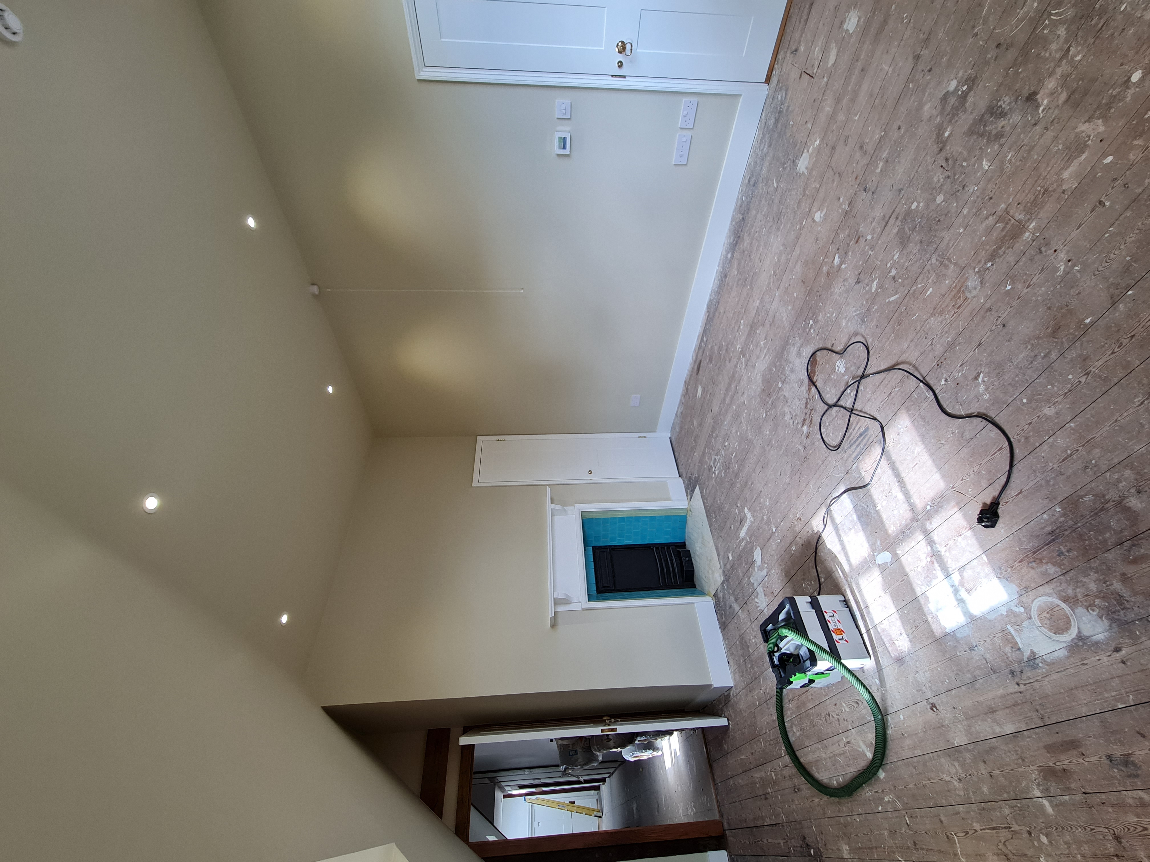 Kitchen freshly plastered and painted cream with recessed spotlights